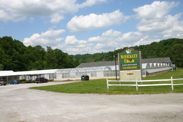 Sewucjket Creek Greenhouses and sign